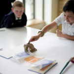 Children around the table creating art